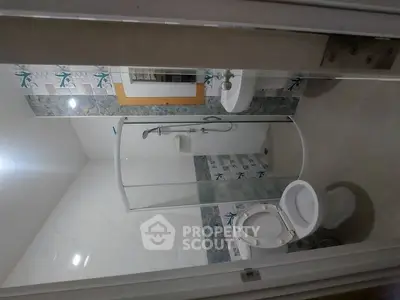 Modern bathroom with shower and stylish tile accents