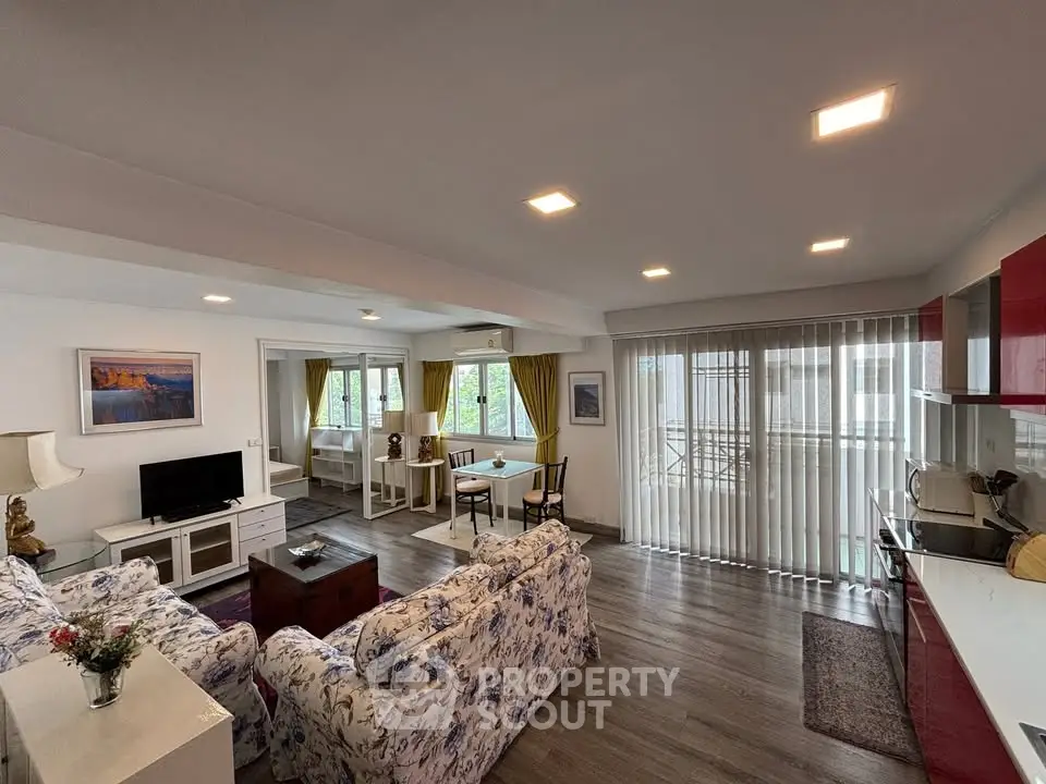 Spacious living room with modern decor and large windows for natural light.