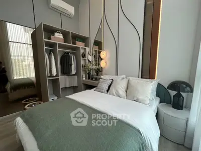 Modern bedroom with stylish decor and built-in closet, featuring cozy bedding and ambient lighting.