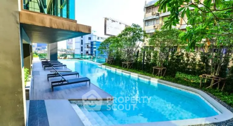 Luxurious outdoor pool area with modern design and lush greenery