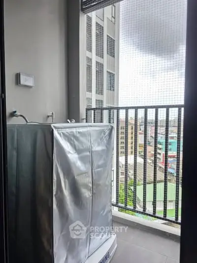 Urban balcony with washing machine and city view, perfect for modern living convenience.
