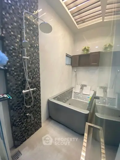 Luxurious bathroom with modern shower and dual soaking tubs