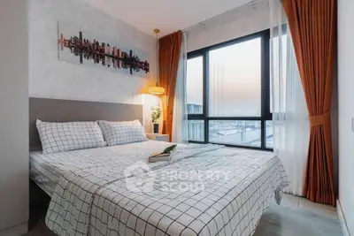 Modern bedroom with city view, stylish decor, and cozy ambiance.