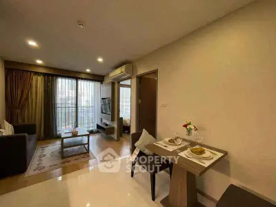 Modern living room with dining area and balcony in a stylish apartment