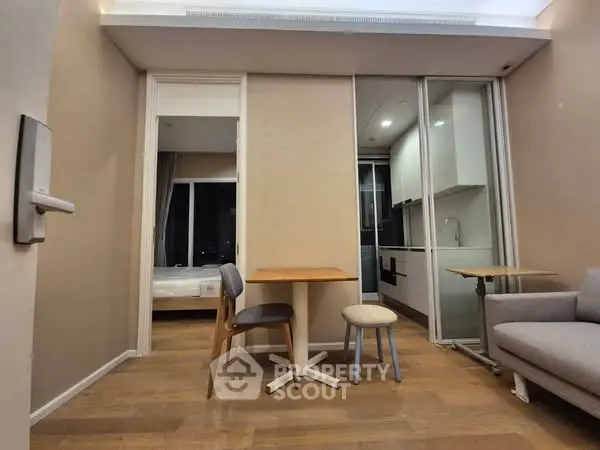 Modern apartment interior with cozy living area and compact kitchen