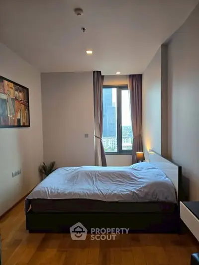 Modern bedroom with city view and stylish decor