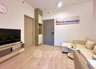 Modern living room with stylish decor and cozy seating area.