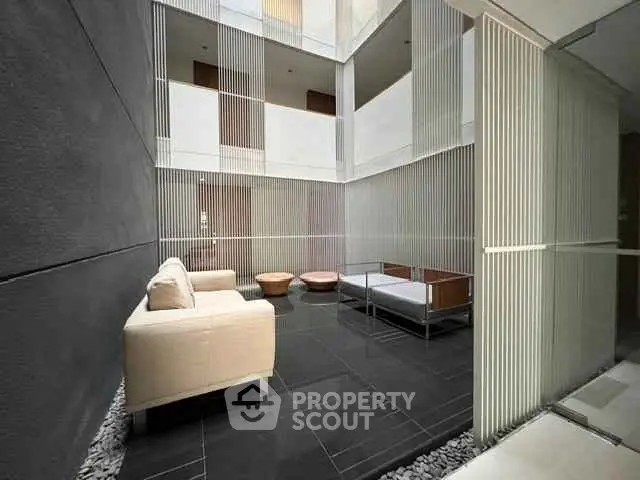 Modern building courtyard with stylish seating and sleek design