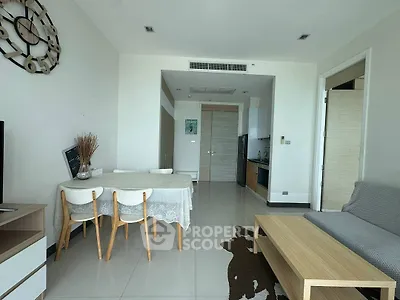 Modern living room with dining area and minimalist decor in a bright apartment.