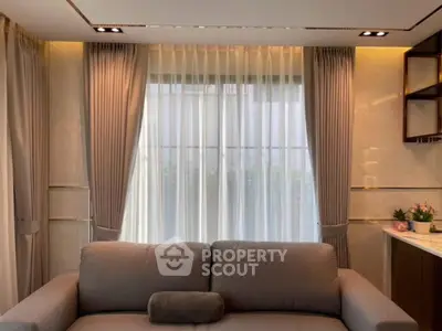 Elegant living room with modern sofa and stylish curtains
