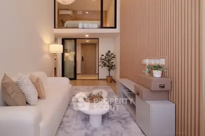 Modern living room with mezzanine, stylish decor, and cozy ambiance in a contemporary apartment.
