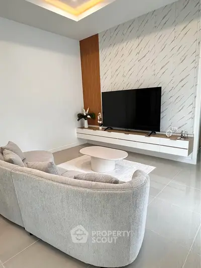 Modern living room with sleek TV setup and stylish decor