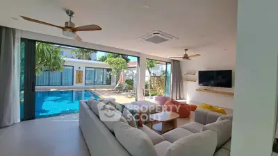 Luxurious living room with pool view and modern decor