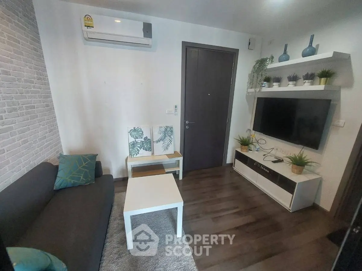 Cozy living room with modern decor and wall-mounted TV
