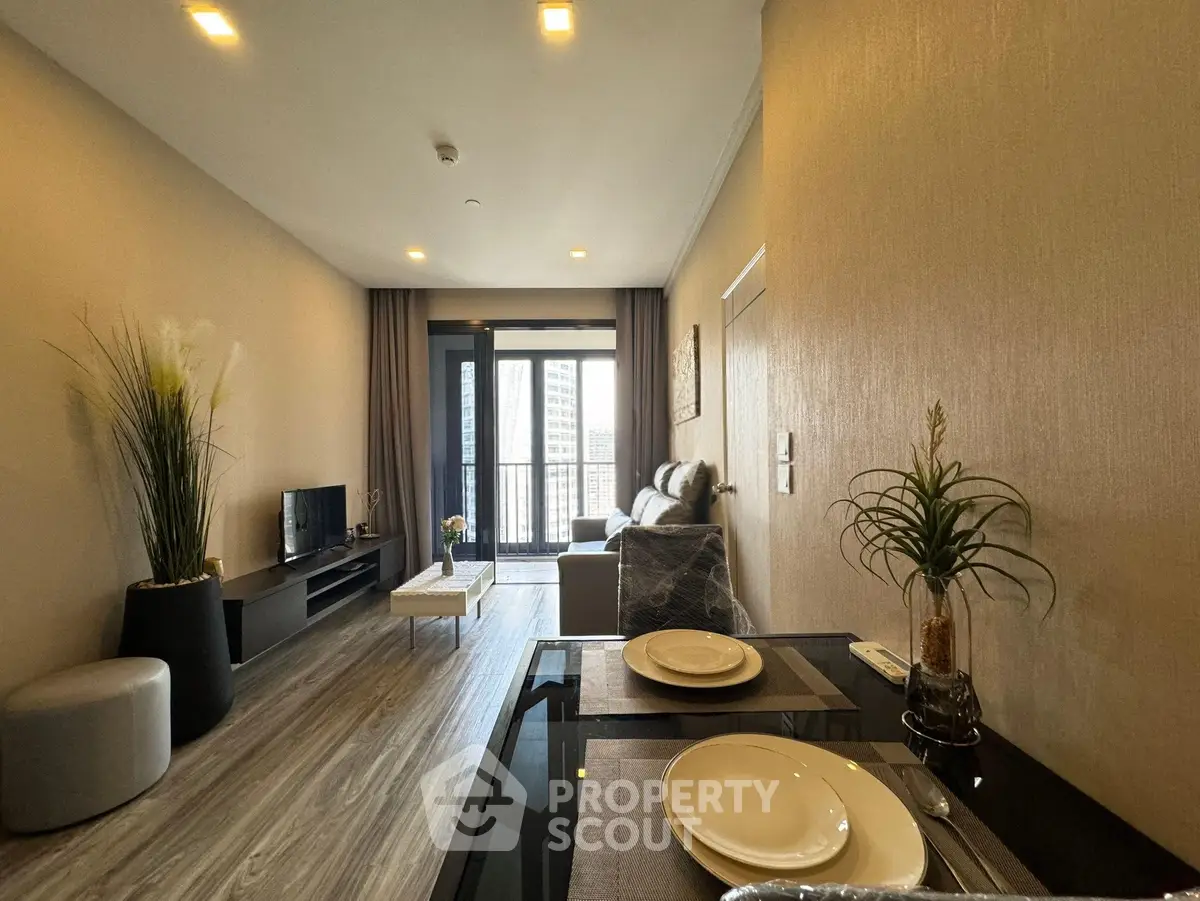 Modern living room with elegant decor and city view balcony in luxury apartment.