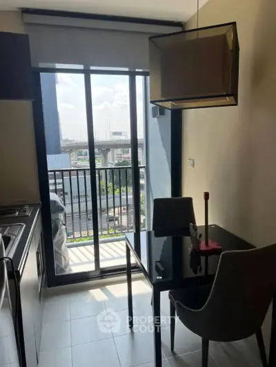 Modern kitchen with balcony view in urban apartment