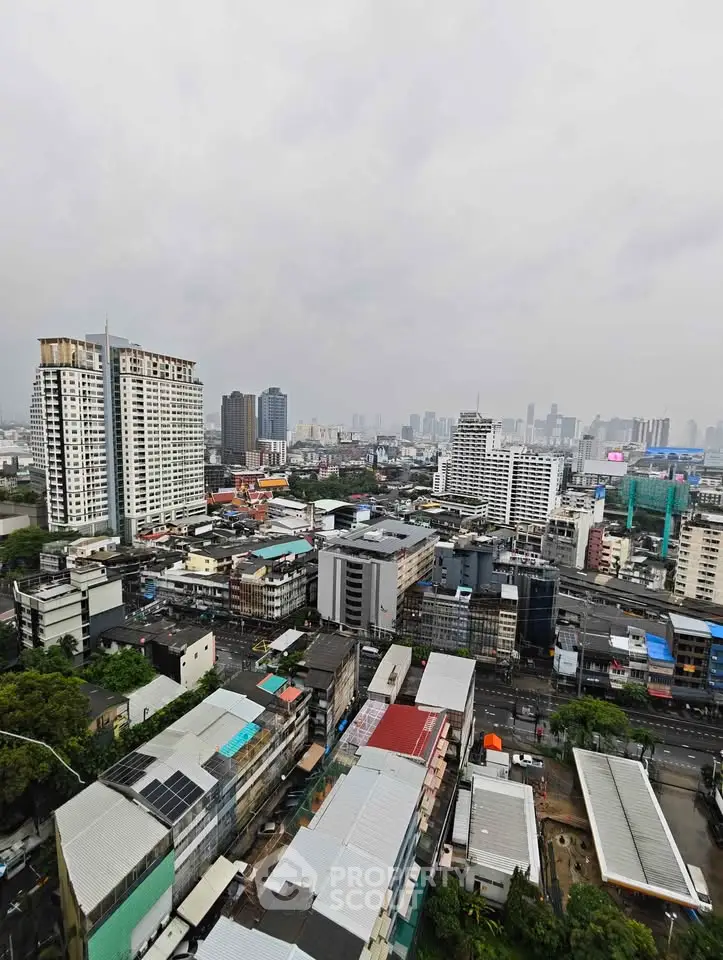 Stunning cityscape view from high-rise building showcasing urban skyline and vibrant city life.