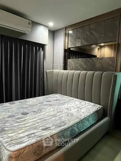 Modern bedroom with stylish bed and elegant decor