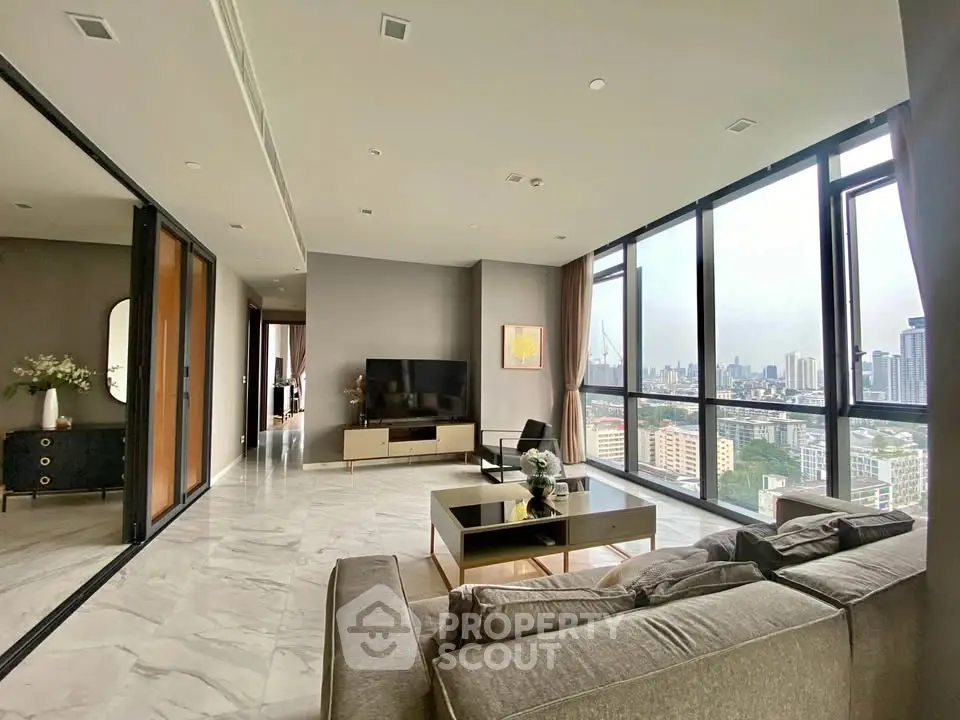 Luxurious living room with panoramic city views and modern decor