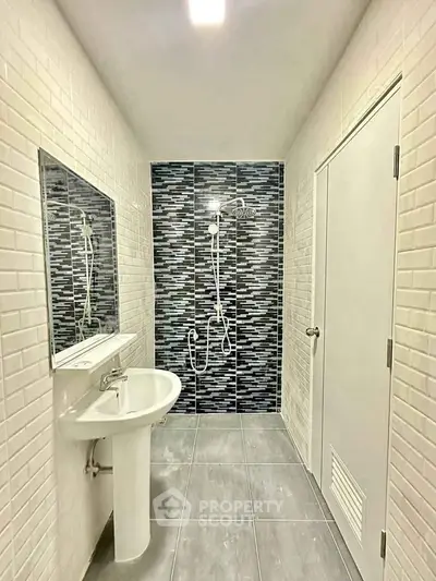 Modern bathroom with stylish tile design and sleek fixtures