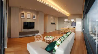 Luxurious modern living room with panoramic city view and elegant decor.