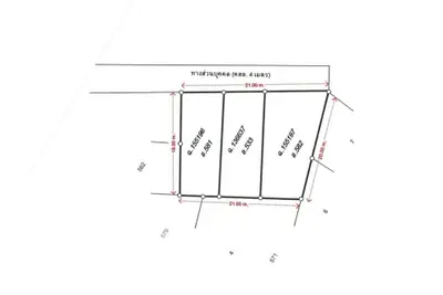 Detailed schematic plan of a real estate plot with measurements and boundaries.