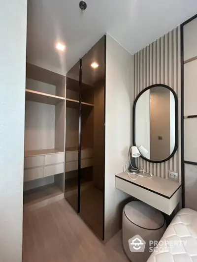 Modern walk-in closet with sleek design and ample storage space