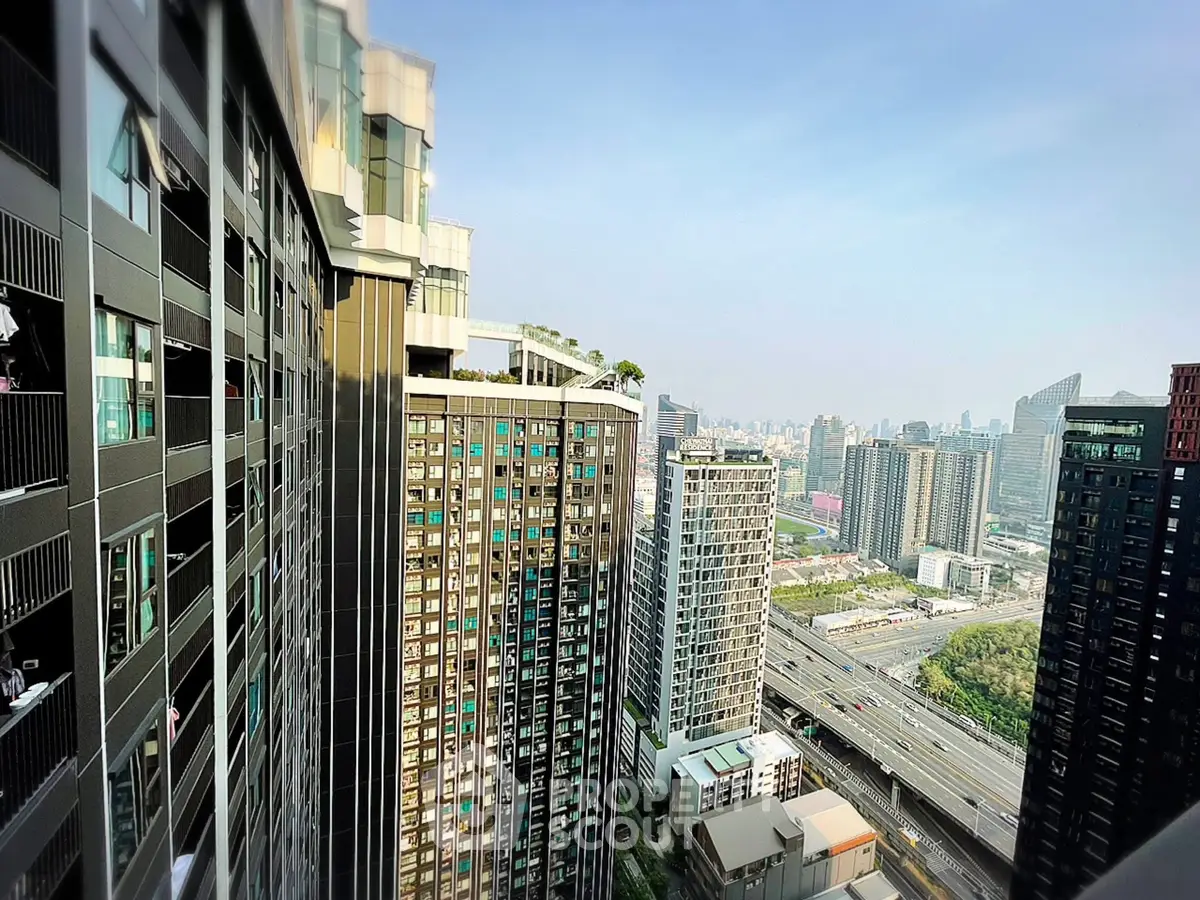 Stunning cityscape view from high-rise building showcasing modern architecture and urban skyline.