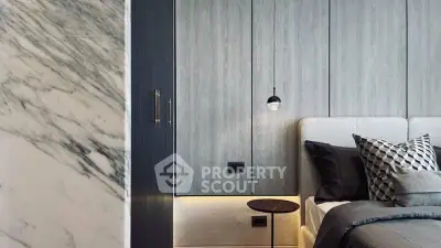 Modern bedroom with sleek design and stylish decor, featuring elegant lighting and luxurious bedding.