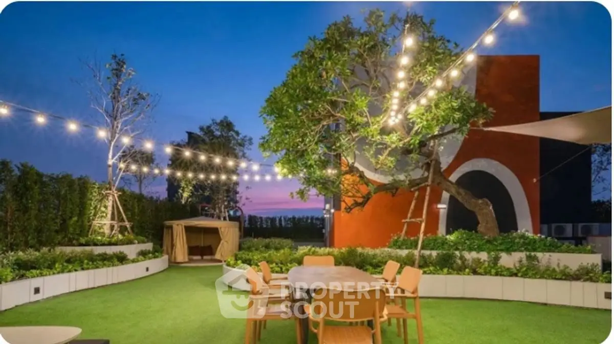 Stunning rooftop garden with ambient lighting and modern outdoor furniture.