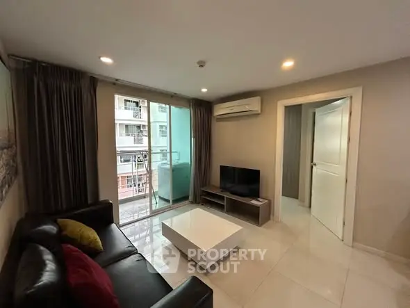 Modern living room with balcony view in urban apartment
