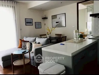 Modern living room with stylish decor and open kitchen layout