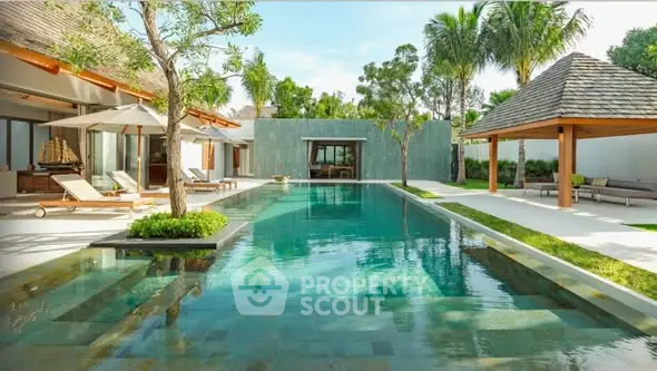 Luxurious villa with stunning pool and lush garden, perfect for relaxation and entertainment.