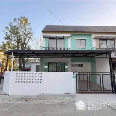 Modern two-story house with spacious driveway and contemporary design