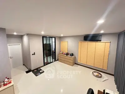Spacious modern living room with sleek design and ample natural light