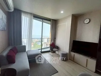 Modern living room with large window and stylish decor