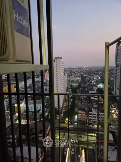 Stunning cityscape view from a high-rise balcony at dusk, showcasing urban living.