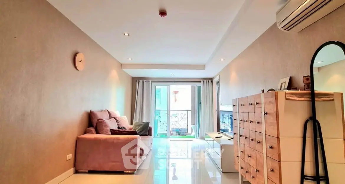 Spacious living room with modern decor and natural light