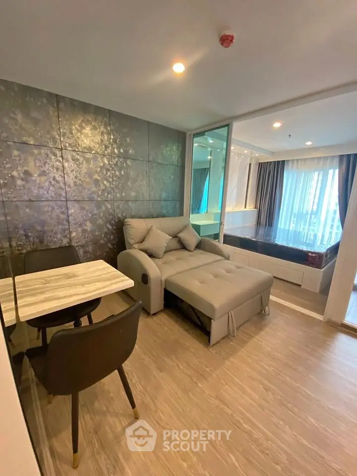 Modern living room with stylish decor and comfortable seating in a contemporary apartment.