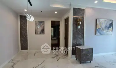 Elegant modern interior with marble flooring and stylish decor in a spacious living area.