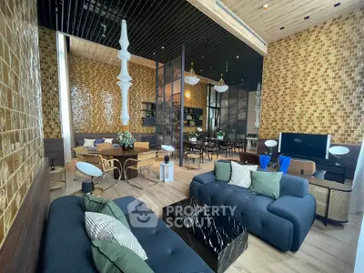 Luxurious modern living room with stylish decor and open layout, featuring elegant furniture and unique lighting.