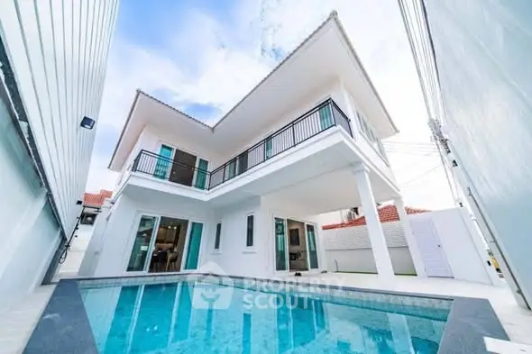 Stunning modern two-story home with pool and spacious balcony.