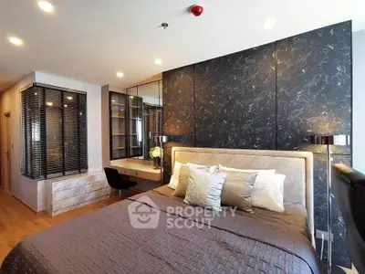 Luxurious modern bedroom with elegant decor and stylish furnishings.