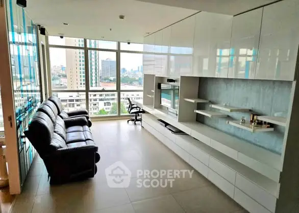 Spacious modern living room with panoramic city view and sleek furniture