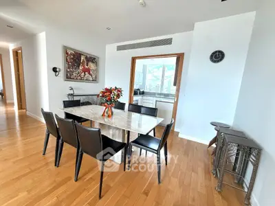 Elegant dining area with modern decor and city view