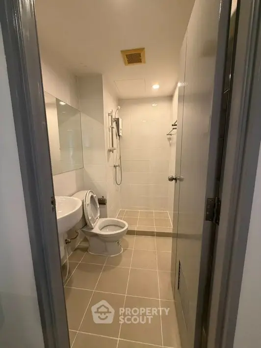 Modern bathroom with sleek fixtures and spacious shower area