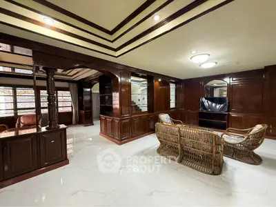 Luxurious living room with elegant wooden paneling and stylish furniture
