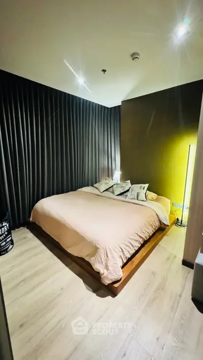 Modern bedroom with stylish decor and cozy lighting