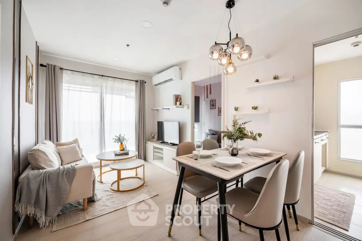 Modern living room with dining area, stylish decor, and natural light in a cozy apartment.