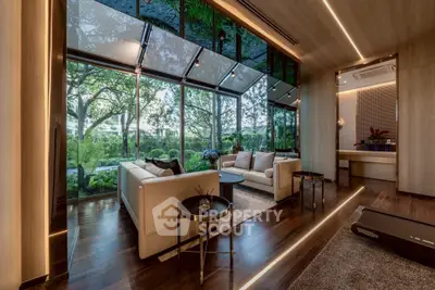 Luxurious living room with floor-to-ceiling windows and stunning garden view